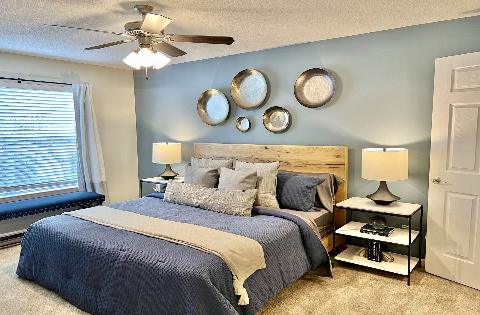 a bedroom with a bed and a ceiling fan at Reserve at Park Place Apartment Homes, Hattiesburg